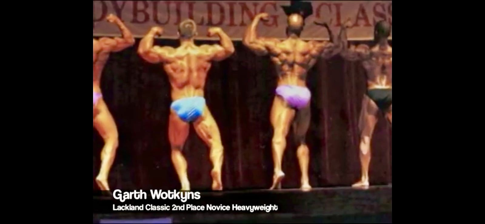 Posing routine under the stage lights at the bodybuilding championships